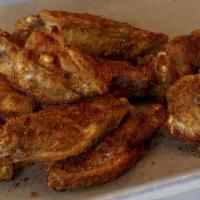 Traditional Wings · Choice of sauce: Hot Garlic, House Hot, BBQ, or Whiskey. Served with Buttermilk Herb or Blue...