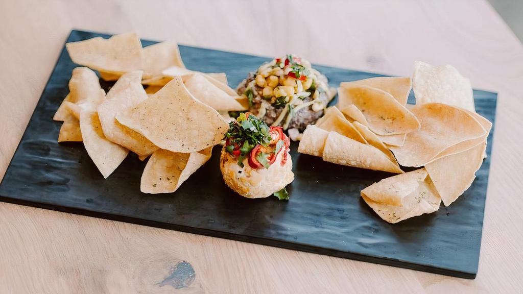 South West Plate · Spicy Pimento Cheese Dip, Black Bean Hummus, Corn Relish, Pickled Fresno Chilies, Avocado Crema, Ranch Seasoned Tortilla Chips (vg)