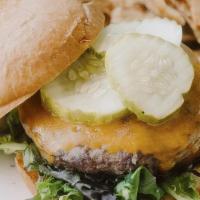 All American Cheeseburger · 2 Aged Angus Patties, Cheddar, Lettuce, Tomato, Onion, Pickles, Brioche Bun. Served With Hou...