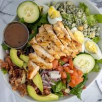 Maw Cobb · Grilled chicken strips, chopped romaine, avocado, red onion, cucumbers, bacon, hard-boiled e...