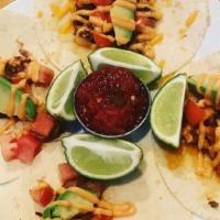 Baja Avocado Tacos · 2 tacos served with tomato, cilantro, and avocado served with a side of baja sauce and chips...