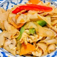 Spicy Noodles · Stir fried flat rice noodles with onion, bell peppers, mushrooms, fresh basil leaves and chi...