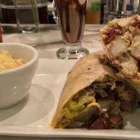 Breakfast Burrito · Potatoes, green chilis, eggs cheddar, bacon, avocado cream, and crème fraiche.