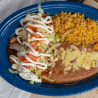 Burrito Especial · Tender chunks of beef, chicken, or pork topped with lettuce, shredded cheese, diced tomatoes...