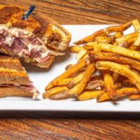 Reuben Sandwich · Thinly Sliced Corned Beef with Swiss, 1000 Island and Sauerkraut on Toasted Rye Bread.