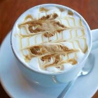 The Karmel Sutra · Steamed & frothed milk sweetened with vanilla & marked with two shots of espresso & caramel ...
