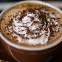 Hot Cocoa · Monin chocolate sauce with steamed milk & whipped cream, dusted with cocoa powder.
