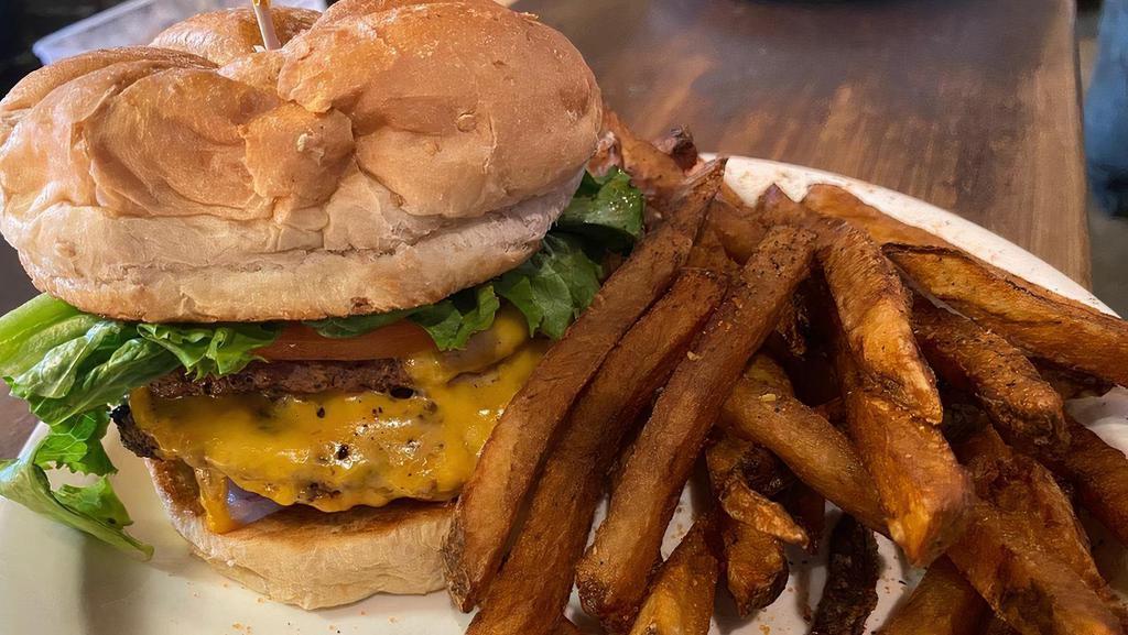 Cafe Burger · Two all-beef patties, yellow cheddar cheese, lettuce, tomato,pickles,red onion, mustard & mayo on a whole wheat bun. Served with your choice of side