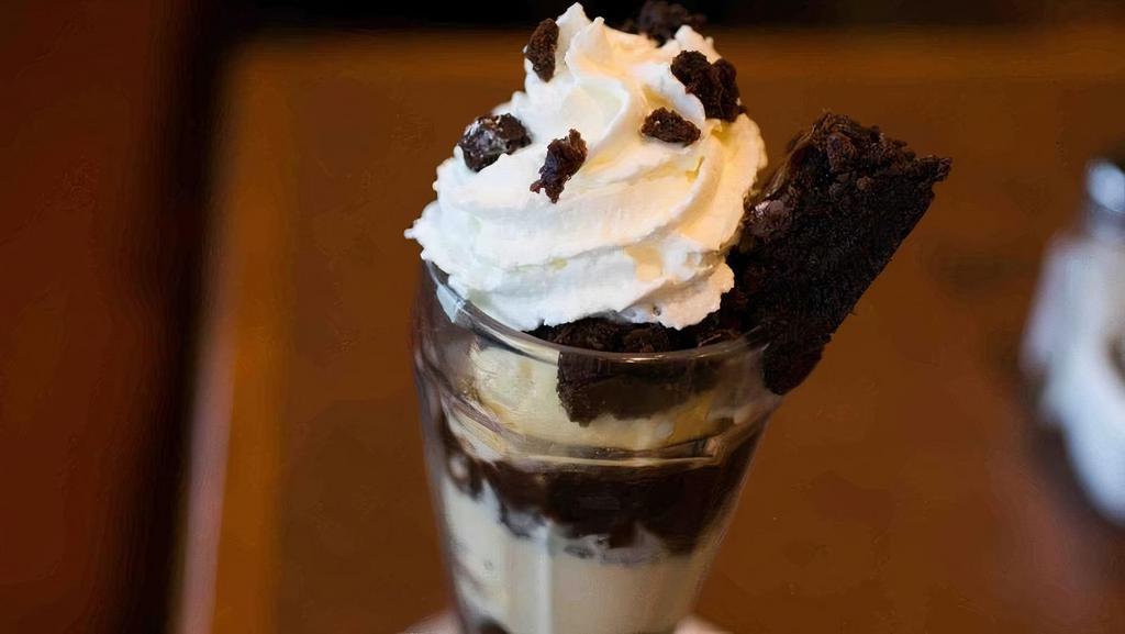 Brownie Sundae · Two scoops of ice cream, hot fudge & the brownie of your choice, topped with whipped cream.