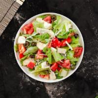 Mozzarella Fresca Salad · A bed of lettuce topped with Roma tomatoes, roasted red peppers, fresh mozzarella, prosciutt...