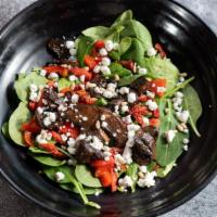 Spinach Formaggio Salad · Baby leaf spinach with sun-dried tomatoes, marinated portabella mushrooms, roasted red peppe...
