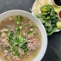 Pho Tai · Beef noodle soup, sliced beef flanks, pho noodles, cilantro and scallions. On the side: mint...