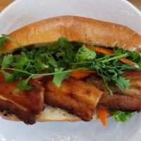 Pork Belly Banh Mi · Braised pork belly, pate, mayonnaise, cilantro, pickled carrots and daikon, lettuce, cucumbe...