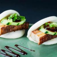 Pork Belly Bao (2 Baos) · Two folded steamed buns stuffed with braised pork belly and cucumber lined with hoisin sauce...