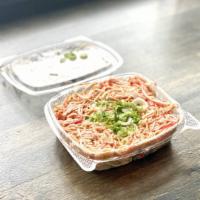 Spicy Crab Salad · Crab meat mixed with Spicy Mayo and eel sauce on top of cucumber base, Green Onion on top.