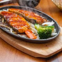 Salmon Teriyaki · Grilled and served on sizzling plate, assorted veggies, house made teriyaki sauce, sesame se...