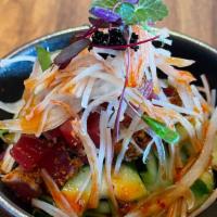 Volcano Salad · Diced pepper tuna, fresh cucumbers, white onions and shredded crab sticks.  Topped with blac...