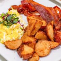 Eggs Your Queens Way · Two eggs, rosemary potatoes, bacon, sausage or vegan sausage, and choice of toast.