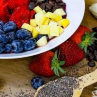 Açaí Bowl · Fresh berries, banana, mango or chocolate, granola, toasted coconut flakes, and chia seeds.