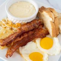Breakfast Plate · Eggs, hash browns, grits, toast and your choice of bacon, sausage or ham.
