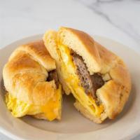 Croissant Sandwich · Eggs, cheese, and your choice of bacon, sausage or ham.
