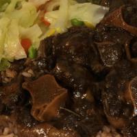 Oxtail · Marinated and cooked to perfection with garlic, thyme, scotch bonnet pepper, onion and mixed...