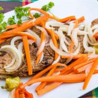 Red Snapper · Escovitch red snapper, fish is fried and then we add a vinegar sauce with bell pepper, carro...
