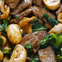 Beef With Mushrooms · Served with white rice.