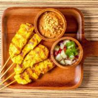 Chicken Satay (4) · Chicken tenders marinated in coconut milk, thai spices, char-grilled, served with peanut sau...