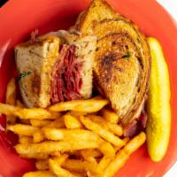 Classic Reuben · Half pound of pastrami and corned beef, Swiss cheese, and sauerkraut with Russian dressing.