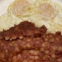 Grilled Corned Beef Hash & Eggs · Tender grilled corned beef and two eggs.