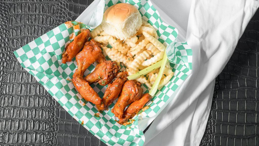 Traditional Wings · Crispy wings made to order. Tossed in your favorite season or sauce. Served with celery, carrots and ranch or bleu cheese served with fries.