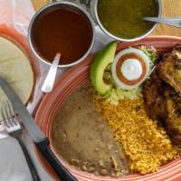 Breaded Chicken / Milanesa De Pollo · Plates served with rice, beans, corn or flour tortillas, and salad.