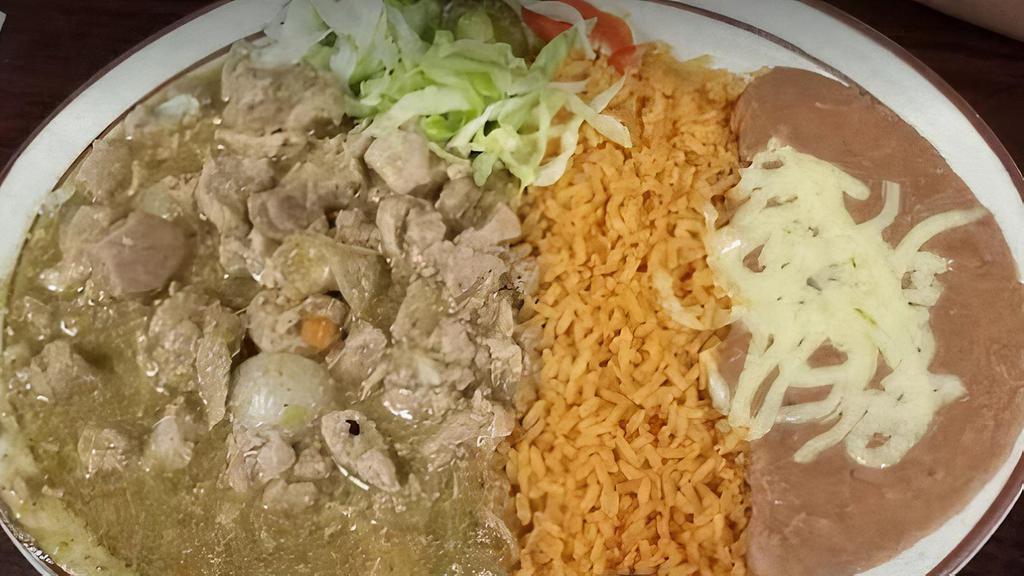 Chile Verde · Tender Pork, carnitas with savory green sauce. Served with rice, black beans and tortillas.