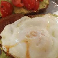 Avocado Toast · Served with one egg, tomatoes and cucumbers.