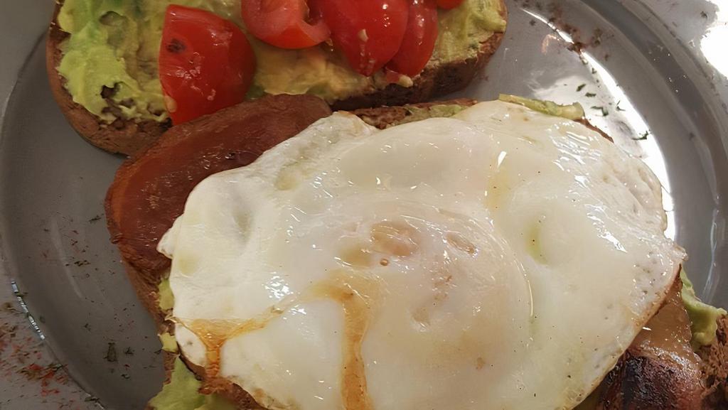 Avocado Toast · Served with one egg, tomatoes and cucumbers.