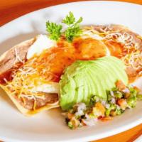 Huevos Rancheros · Two corn tortillas layered with refried beans topped with two eggs cheddar cheese salsa and ...
