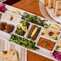 Anatolian Appetizer Platter · Hummus, baba ghanouj, grape leaves, tabbouleh, falafel, kibbeh, spice (acili ezme).