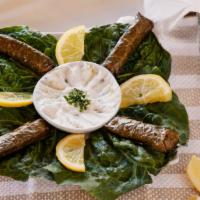 Grape Leaves · Stuffed with rice, onion, parsley, ground beef & spices cooked in lemon juice & olive oil.