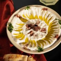 Labneh · Homestyle thick yogurt spread topped with dry mint & olive oil.