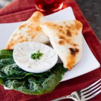 Spinach Pie · Stuffed triangle-shaped pies with spinach, Onion, sumac spice & olive oil.