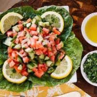 Shepherd Salad · Tomatoes, cucumber, onions, olive oil, parsley, lemon juice.