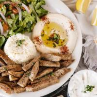 Gyro Plate · Mixture of lamb & beef grilled on upright skewer and thinly sliced with tzatziki.
