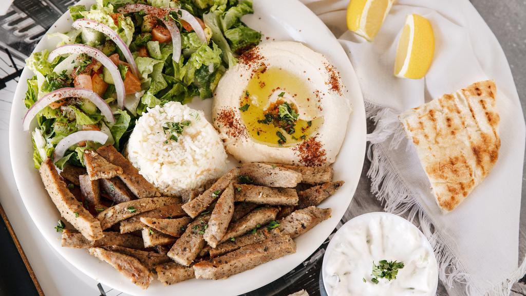 Gyro Plate · Mixture of lamb & beef grilled on upright skewer and thinly sliced with tzatziki.