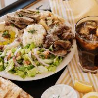 Tripple Plate · Combination of chicken shawarma, beef shawarma and gyro.