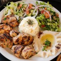 Chicken Shish Kabob · Marinated cubes of seasoned chicken breast charbroiled on a skewer.