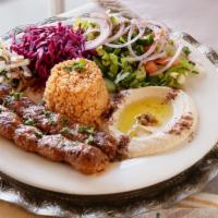 Adana Kabob · Fresh ground lamb blended w/ houses spices then charbroiled on skewers.
