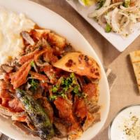 Iskender · Vertically grilled ground beef and lamb combination, sliced and served over homemade bread, ...