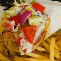 Kabab Pitas · Served in a pita with tomatoes, red onions, cucumbers, a few fries, feta cheese, & tzatziki ...