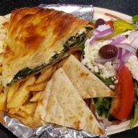 Spinach Pie Platter · Baked Spinach pie served with a Greek salad, fries, grilled pita bread and tzatziki sauce.